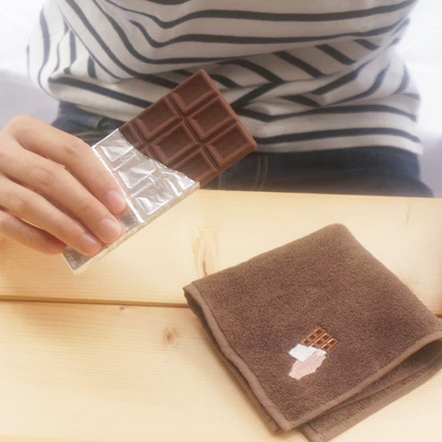 Person Using Foodie Handkerchief While Eating Chocolate